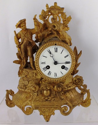 A LATE 19TH/20TH CENTURY SPELTER MANTEL CLOCK having figural and floral case with game, eight day