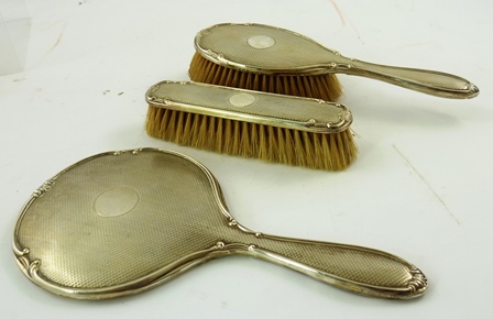 WALKER & HALL A THREE PIECE SILVER BRUSH SET each having engine turned back with un-engraved