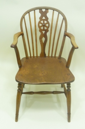 A POSSIBLY 19TH CENTURY WINDSOR CARVER CHAIR having stick back, ash frame, elm seat & turned beech