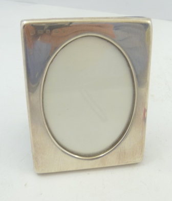 FRANCIS HOWARD LTD A SILVER FRONTED PHOTOGRAPH FRAME having oval vignette, Sheffield 1991, 107 x