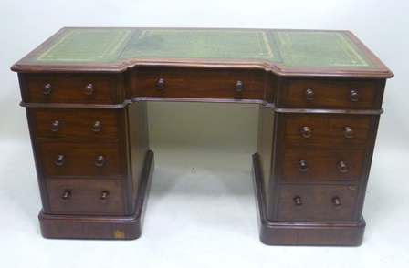 A VICTORIAN MAHOGANY DOUBLE PEDESTAL DESK having flat top with inverted front and modern green