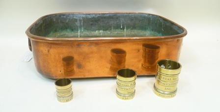 A VICTORIAN COPPER TROUGH having rolled rim and twin cast swing handles, 13cm x 45cm, together with