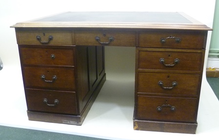 A VICTORIAN MAHOGANY DOUBLE PEDESTAL DESK having skiver inset top with moulded surround, over six