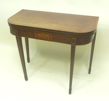 AN EARLY 19TH CENTURY MAHOGANY FOLD-OVER CARD TABLE having D-shaped top with later crossbanded