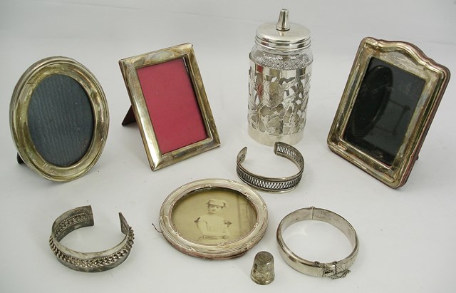 A SELECTION OF SILVER AND SILVER COLOURED METAL ITEMS to include four photograph frames, oval,