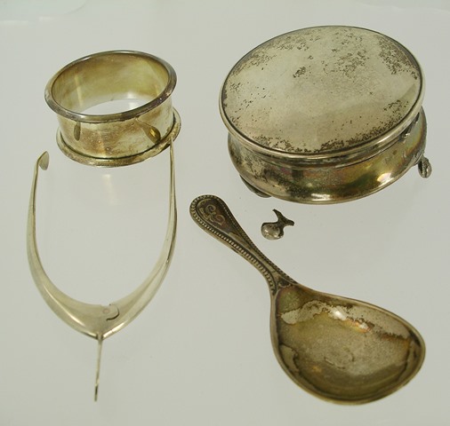 A SELECTION OF SILVER ITEMS comprising; a pair of wishbone sugar tongs, a dressing table tack box,