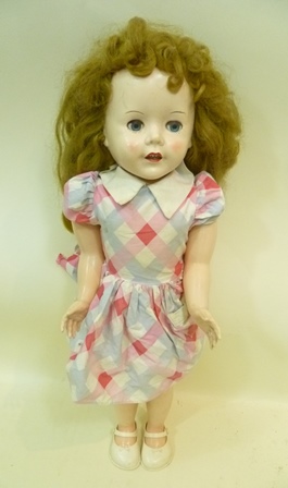 A 1950`s PEDIGREE CELLULOID DOLL, having wild long hair wig, mobile eyes and jointed body with