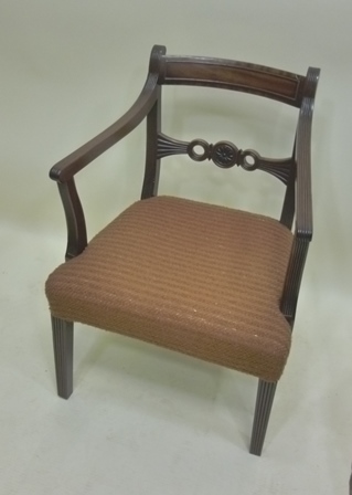 A GEORGIAN MAHOGANY CARVER CHAIR having reeded back and arm supports, rope splat, overstuffed seat,