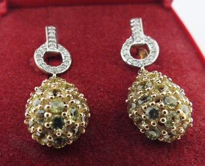 A PAIR OF MODERN WHITE AND YELLOW DIAMOND SET DROP EARRINGS set in gold coloured metal each fitted