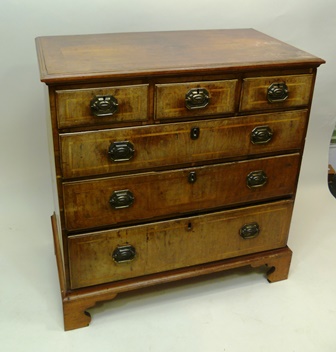 THE UPPER PART OF A GEORGE III WALNUT CHEST ON CHEST having later quarter veneered and cross banded