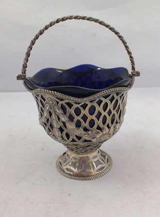 HANNAH HOWARD A VICTORIAN SILVER FRETTED PEDESTAL SWEET MEAT BASKET having up over handle,