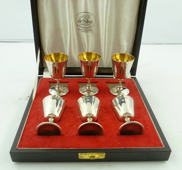 DEAKIN & FRANCIS A SET OF SIX SILVER LIQUEUR GOBLETS each having plain conical bowl, cast stem and