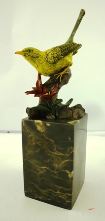 AN ART DECO STYLE COLD PAINTED BRONZE OF A YELLOW BIRD, perched on a blossoming branch, signed ""