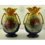 A PAIR OF 19TH/20TH CENTURY CONTINENTAL MONARCH EARTHENWARE VASES, each of tapered ovoid body and