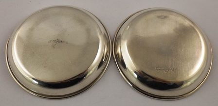 GARRARD A PAIR OF SILVER PIN DISHES, each having a rolled rim, the centre within a relief cast and - Image 2 of 2