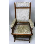 A 19TH CENTURY AMERICAN ROCKING CHAIR having pale green floral cut velour, re-upholstered back,