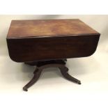 AN EARLY VICTORIAN MAHOGANY TABLE having drop flap top with moulded edge, mounted on a single