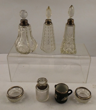 A SELECTION OF SILVER MOUNTED CUT LEAD CRYSTAL ITEMS comprising three dis-similar stoppered scent