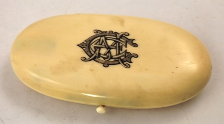 A 19TH CENTURY FRENCH BONE NECESSAIRE having oval hinged case with black inked period monogram, the - Image 2 of 2