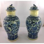 A PAIR OF 19TH CENTURY HAND-PAINTED BLUE AND WHITE ORIENTAL BALUSTER VASES AND COVERS all over