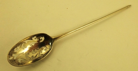 J** W** A GEORGE III SILVER MOTE SPOON having ornamental fretted bowl, makers mark only