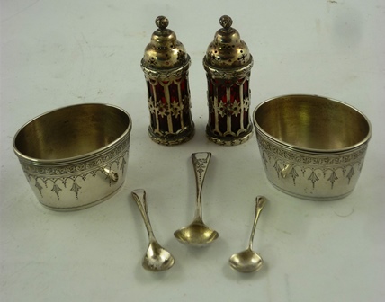 A PAIR OF OVAL VICTORIAN SILVER SALTS with garland decoration, three odd spoons and a pair of ruby