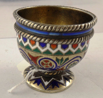 A 19TH CENTURY RUSSIAN ENAMELLED AND SILVER EGGCUP having double banded rim and red, green, white