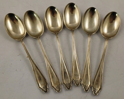 COOPER BROS & SONS A SET OF SIX SILVER COFFEE SPOONS each having a foliate shaped terminal,