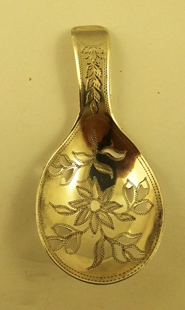 SAMUEL PEMBERTON A GEORGE III REGENCY SILVER CADDY SPOON having fretted and foliate decorated bowl,