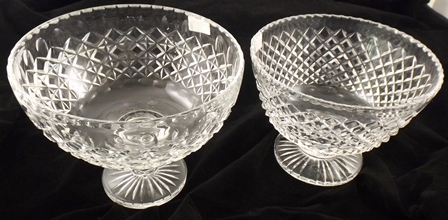 TWO PROBABLY STUART CUT LEAD CRYSTAL ELEVATED BOWLS each deep cut with geometric decoration, 19 x