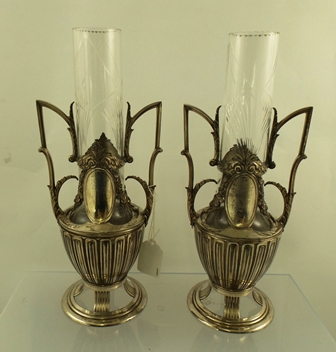 A PAIR OF WMF STYLE ELECTRO PLATED VASES each having a cut decorated cylindrical clear crystal