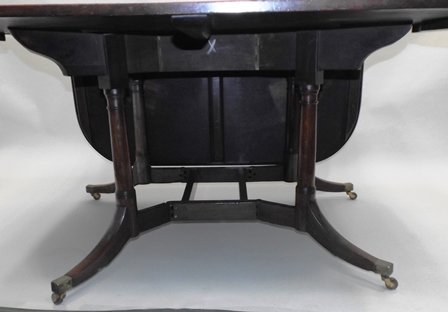 A GEORGE III MAHOGANY DINING TABLE having twin drop flap D end top, mounted on an unusually - Image 3 of 4