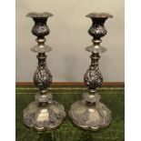 A PAIR OF LATE VICTORIAN/EDWARDIAN EPNS CANDLESTICKS each having detachable sconce, turned and