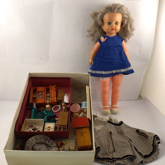 A 1960`s PLASTIC GIRL DOLL with blonde wig, mobile eyes and pull cord talking box, 65cm high,