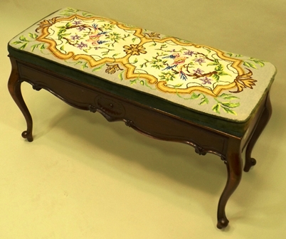 A 1920`s MAHOGANY DUET STOOL having hinged upholstered padded top, paterae and carved frieze, - Image 2 of 2