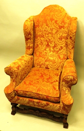 A 20TH CENTURY GEORGIAN STYLE HIGH BACK WINGED ARMCHAIR all over upholstered in a golden floral - Image 2 of 2