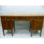 EDWARD BARNSLEY
A MAHOGANY BOW FRONTED SIDEBOARD with three in-line feather walnut drawers and