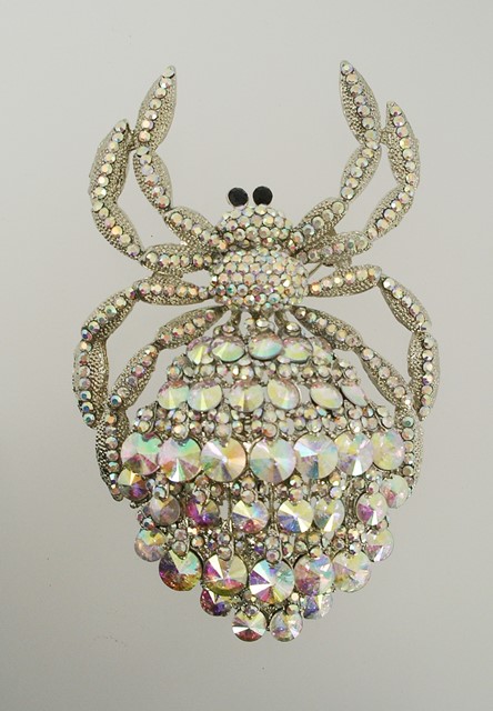 A BUTLER & WILSON BROOCH fashioned as a large spider, set with aurora borealis crystals and stones