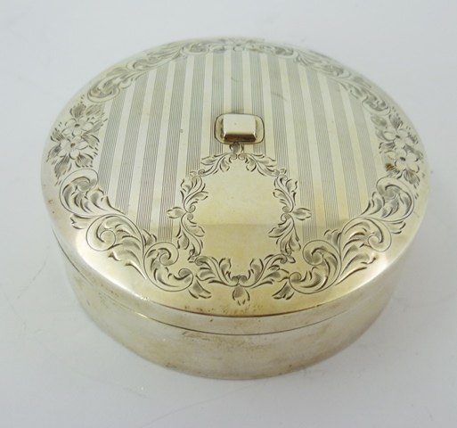 A 19TH CENTURY FOREIGN SILVER RIBBON BOX, having circular push-fit lid with engraved and engine