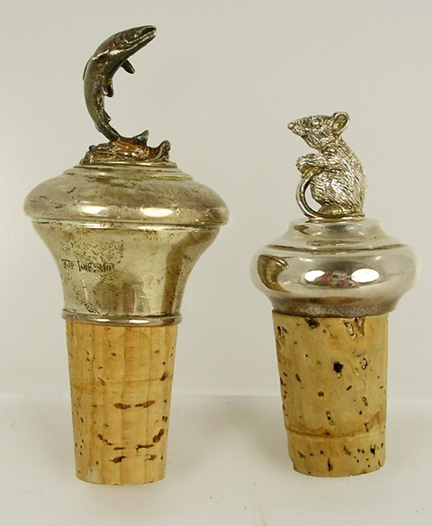 TWO SILVER CAPPED BOTTLE CORKS, one surmounted with a fish by A J Poole, and one with a dormouse by