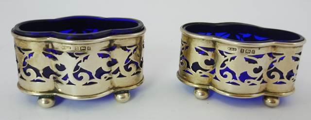 KEIGHT & CO. A PAIR OF SILVER SALTS, having applied wire rim, fancy lobed oval surround and fretted