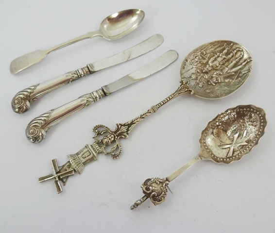 TWO DUTCH SILVER COMMEMORATIVE SPOONS, one repousse worked with two figures, the other with a