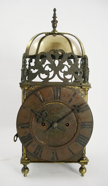A PART VICTORIAN BRASS LANTERN CLOCK having English dial type period brass mechanism with twin