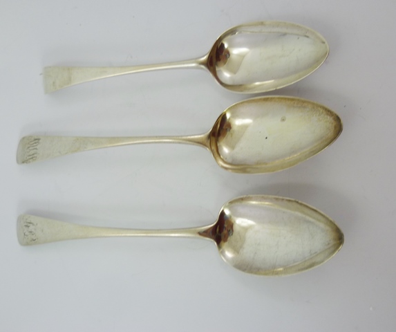 THREE GEORGIAN SILVER OLD ENGLISH PATTERN BASTING SPOONS, various assays, two monogrammed, 165g