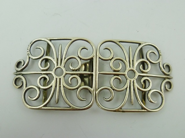 LAWRENCE EMANUEL A SILVER NURSE`S BUCKLE fashioned with scrolled wire, Birmingham 1895, 76g