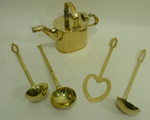 THREE 19TH/20TH CENTURY BRASS LADLES, together with a heart shaped BRASS SCOOP and a BRASS WATERING
