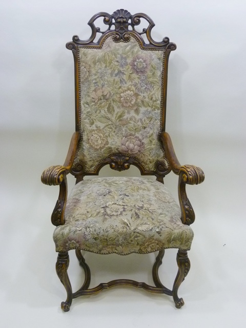 A 20TH CENTURY CONTINENTAL BAROQUE INFLUENCED SHOW WOOD FRAMED ARMCHAIR with fancy carved and