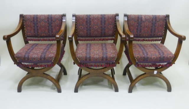 A LATE 20TH CENTURY OAK FINISHED DINING SUITE comprising; a rectangular topped draw leaf table