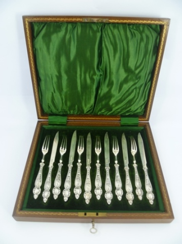 ROBERTS & BELK A SET OF SIX SILVER FRUIT KNIVES AND FORKS, each having hallmarked blade and tines,