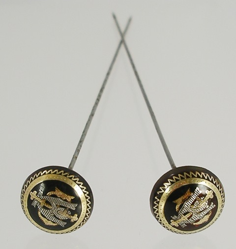 A PAIR OF PIQUE GOLD AND SILVER INLAID TORTOISESHELL HAT PINS of hemispherical form